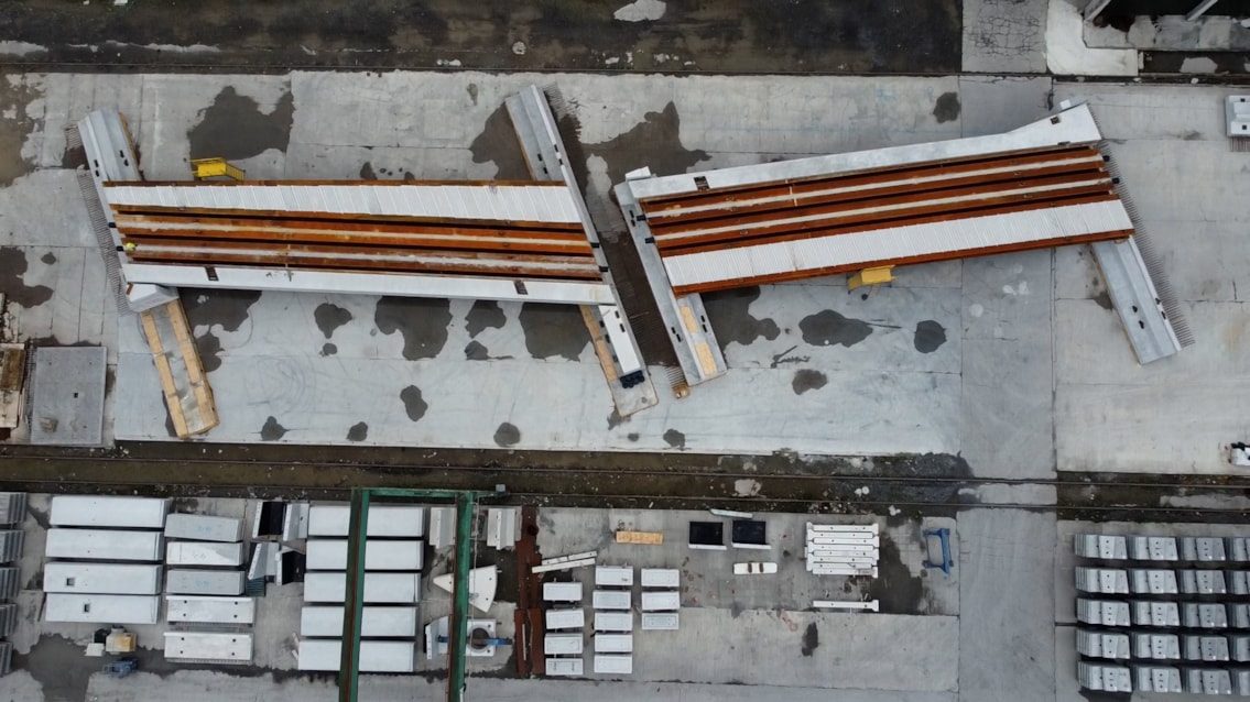 Irish trial assemblies complete as huge railway bridge sets sail for Stockport: Aerial drone shot of two thirds of Greek Street railway bridge during assembly trials in Ireland