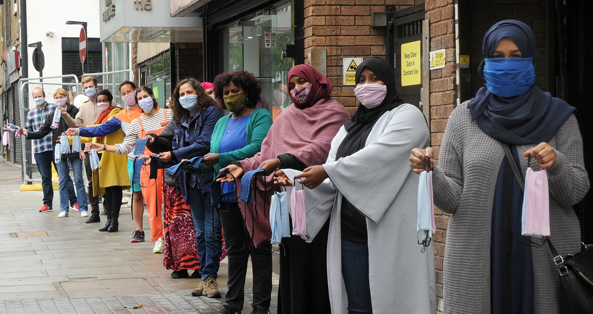 Cllr Asima Shaikh, centre, with members of the community sewing groups and their masks.