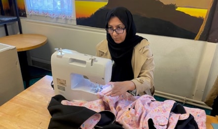 Afghan refugee Aziza sews an incubator cover