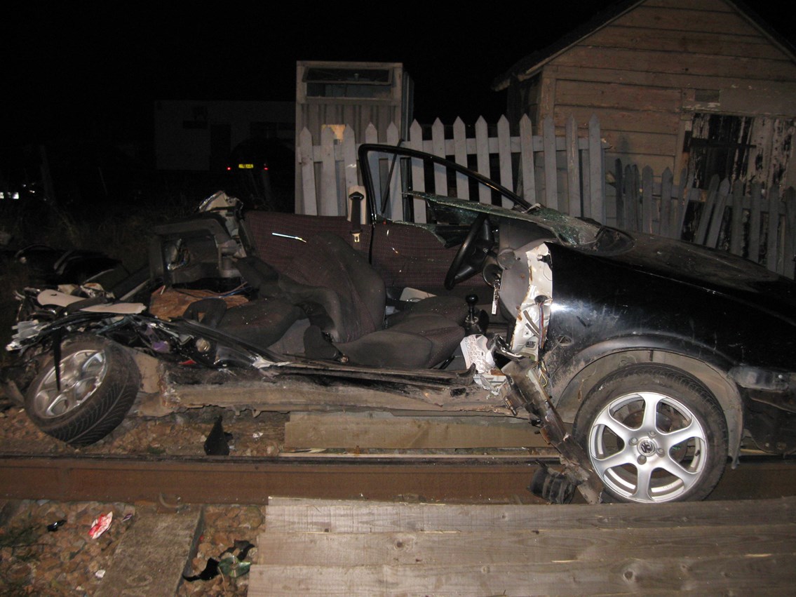 Remains of car after smash with train at Sandhill crossing near Cambridge (2): Remains of car after smash with train at Sandhill level crossing, Cambs.<br /><br />Richard Martin, 22, of Cambridge was jailed for eight months and banned for driving for two years after swerving round barriers at Sandhills crossing and smashing into a train travelling at 60mph.