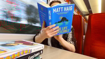 Person Reading A Book on LNER Azuma Train