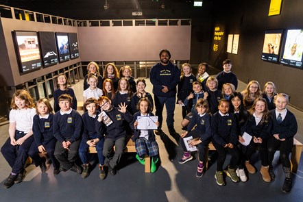 Wildlife cameraman and presenter Hamza Yassin met children from Edinburgh's Bun Sgoil Taobh Na Pairce (Parkside Primary School) at the opening of the new exhibition, Wildlife Photographer of the Year, which opens on Saturday 20 January at the National Museum of Scotland. Image © Duncan McGlynn-3