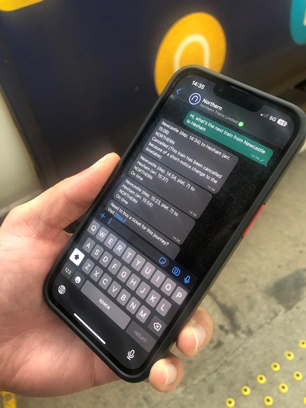 This image shows the new whatsapp service being used on a phone next to a Northern train