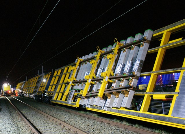 Track panels ready to lowered: New track panels ready to be lowered from Network Rail's tilting wagons