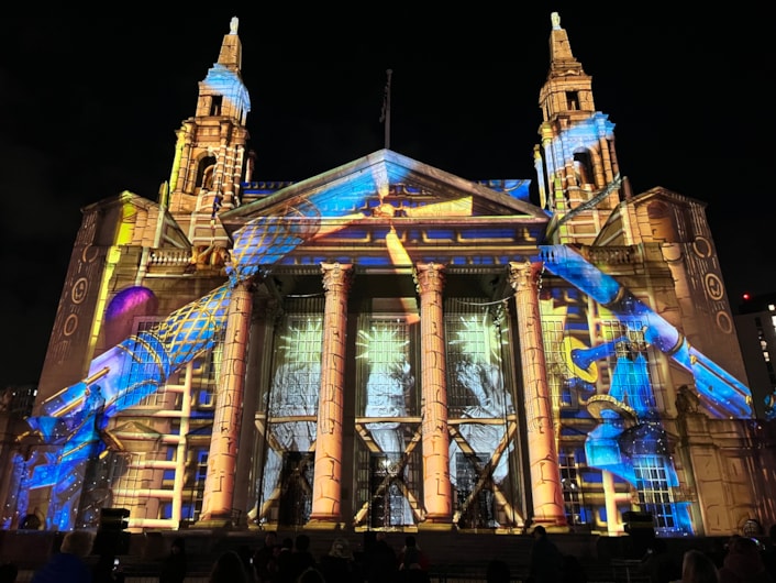 Light Night 2025: At Leeds Civic Hall a remarkable new commission by Portuguese artists Ocubo, co-produced by the British Library, was projected across the building’s façade.
Entitled, Portals: The Machine of Worlds, the piece uses fantastical imagery from books in the library’s collection, exploring universes of science, illusion and discovery.