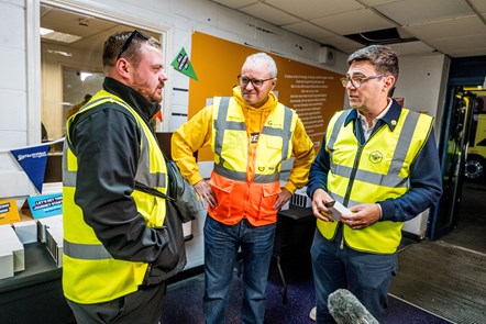 Andy Burnham (R), Mayor of Greater Manchester, meets Go-Ahead drivers involved in operating the city's first franchised buses, along with Nigel Featham, Managing Director of Go North West (centre).