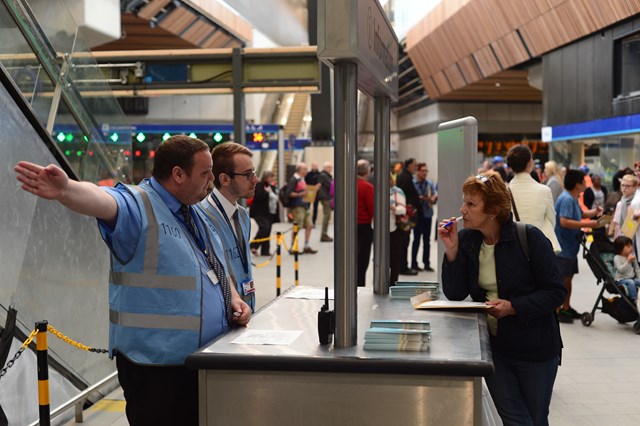 Station staff: Station staff assist a woman at the new London Bridge station