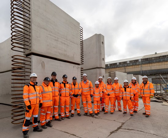 EKFB and Stanton Precast staff in front of some of the completed tunnel segments.: EKFB and Stanton Precast staff in front of some of the completed tunnel segments.