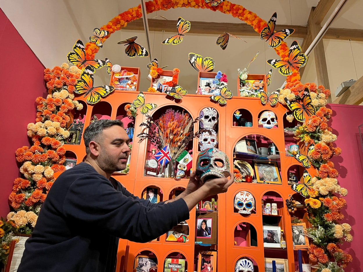 Living with Death: Adam Jaffer, Leeds Museums and Galleries' curator of world cultures, with a stunning Leeds Ofrenda, on loan from artist Ellie Harrison, recreates beautiful, traditional Mexican Day of the Dead displays.
Leeds City Museum’s Living with Death exhibition, which opens today (May 3) features a remarkable array of objects spanning thousands of years of world history and tradition which all explore how different cultures experience death, dying, and bereavement.