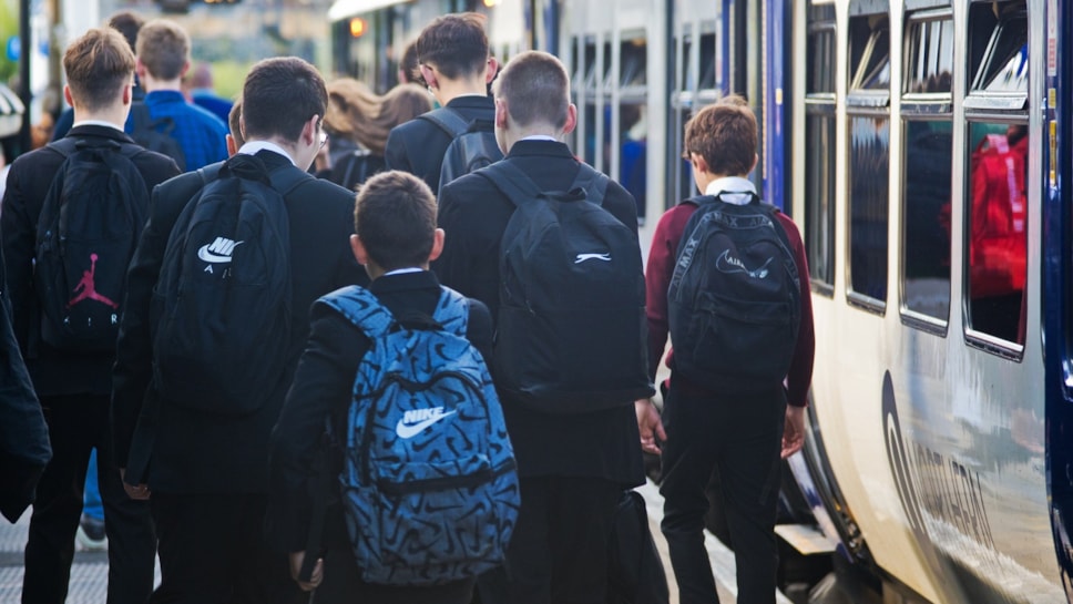 Image shows schoolchildren commuting to school