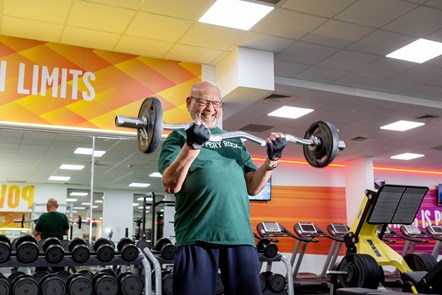 A stock image of a user lifting weights at the Sobell Leisure Centre gym