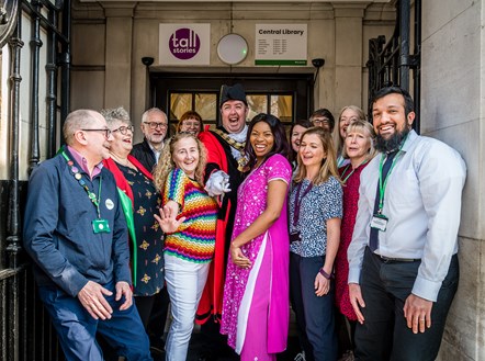 Mayor of Islington Cllr Troy Gallagher, centre, cuts the ribbon to officially reopen the main entrance to Central Library, accompanied by library staff, the Tall Stories team, councillors and Islington North MP Jeremy Corbyn.