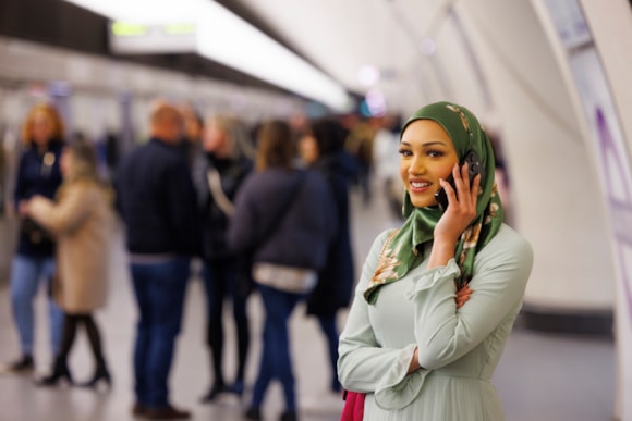 Mobile coverage on the Elizabeth line complete ahead of festive season: TfL Image - Customer using mobile phone on Elizabeth line platform