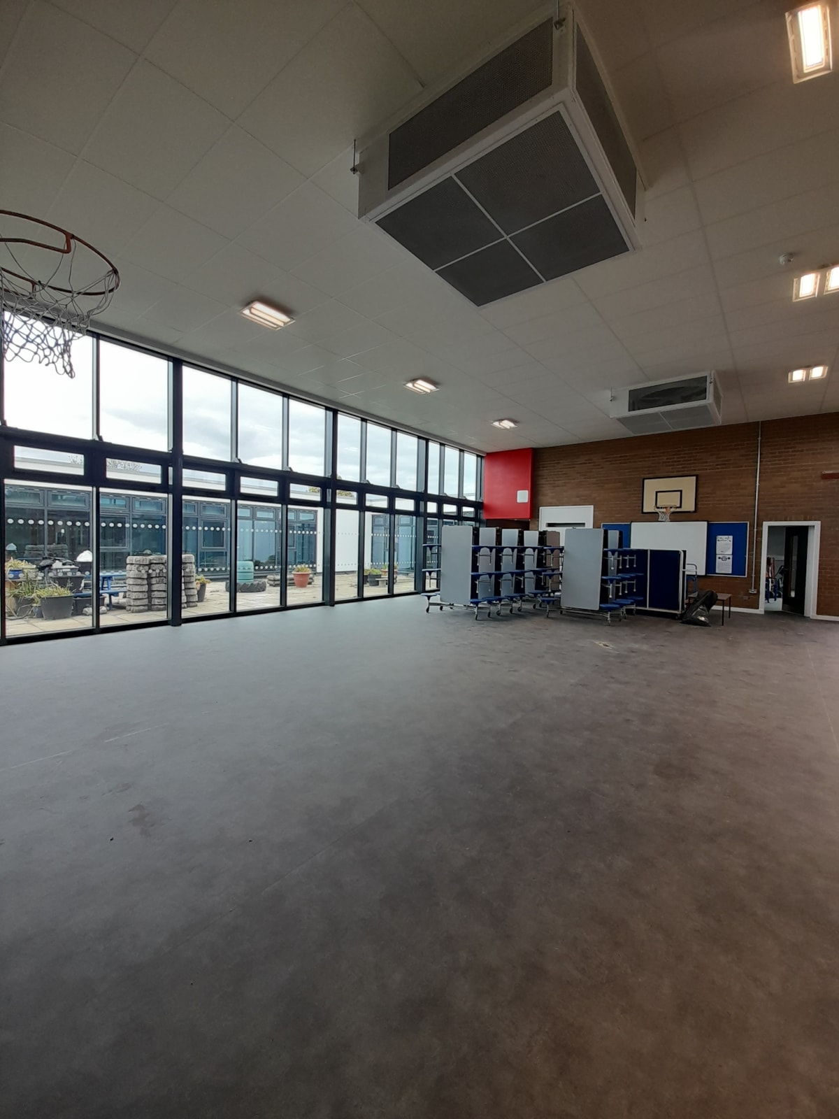 Another view of the refurbished school hall at Cullen Primary School, featuring improved flooring, lighting and ventilation.