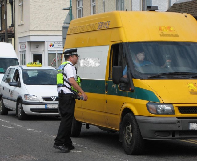 Gillingham Level Crossing Awareness Event: A British Transport Police officer highlights dangers of level crossing misuse with a van driver