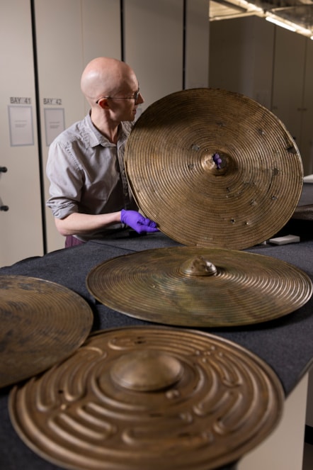 National Museums Scotland curator Dr Matthew Knight with the Bronze Age shields. Photo © Duncan McGlynn (10)