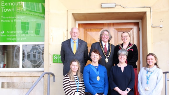 Representatives from East Devon District Council and Exmouth Town Council standing in front of Exmouth Town Hall