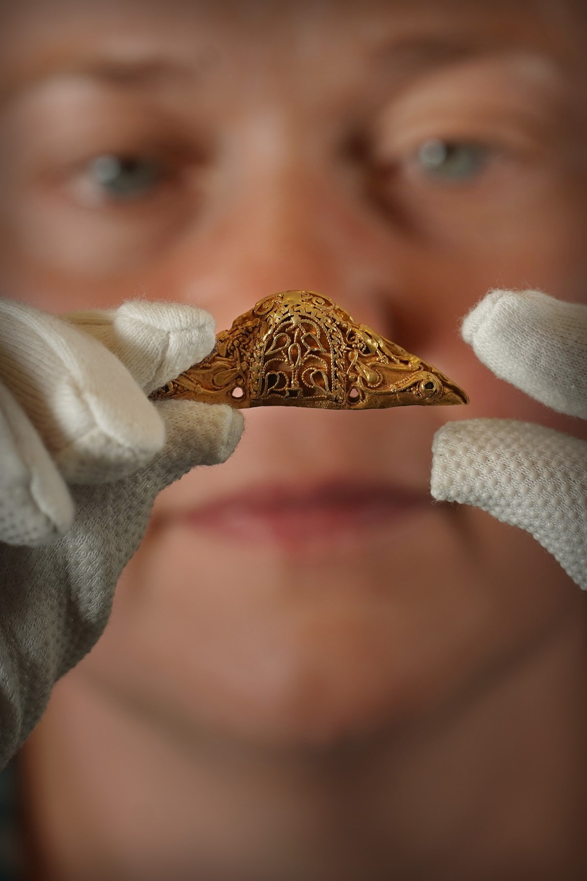 Senior Curator Dr Alice Blackwell holds the rare early medieval gold sword pommel. Photo © Stewart Attwood (3)