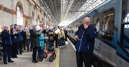 Joe Crean greeted by family, friends and colleagues at Manchester Piccadilly