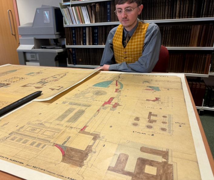 Leeds Town Hall clock tower: Archives assistant Alex Pearson with the plans for the Leeds Town hall clock tower.
Created in 1857, a year before the building was opened by Queen Victoria, the elaborate illustrations are part of the collection at West Yorkshire Archives Service and include the classical stonework and emblematic owls adorning the tower exterior.
They were prepared as part of the “articles agreement” put together by contractors Addy and Nicholls, who took on the mammoth task of constructing the tower.