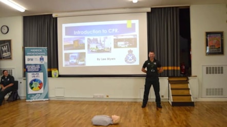 Lee Myers teaching CPR