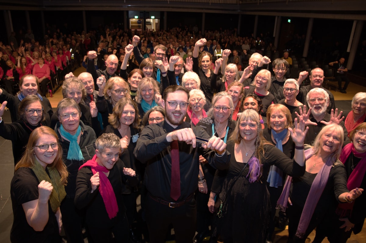 Lancaster Millennium Choir were crowned the overall winners of Lancashire Choir of the Year 2025, shown with the audience behind them