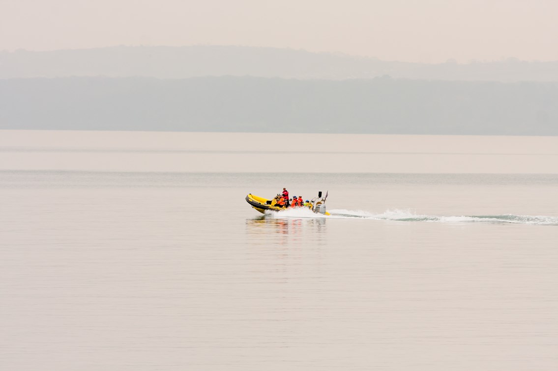 RIB at Teignmouth 4: Unmanned Aerial Vehicle (UAV) being launched from a Rigid Inflatable Boat (RIB) at Teignmouth as part of a geological survey to improve the resilience of the railway between Exeter and Newton Abbot