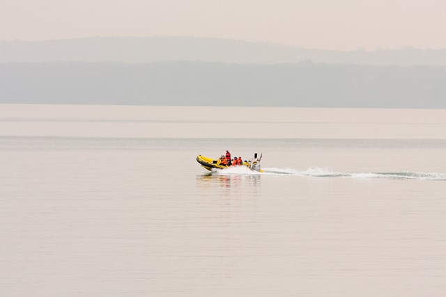 RIB at Teignmouth 4: Unmanned Aerial Vehicle (UAV) being launched from a Rigid Inflatable Boat (RIB) at Teignmouth as part of a geological survey to improve the resilience of the railway between Exeter and Newton Abbot