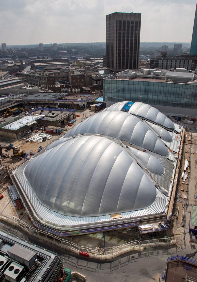 Army of 11,000 railway engineers to work on record-breaking Christmas investment programme to deliver a bigger, better railway: Final piece of ETFE going onto the atrium at Birmingham New Street Station - portrait