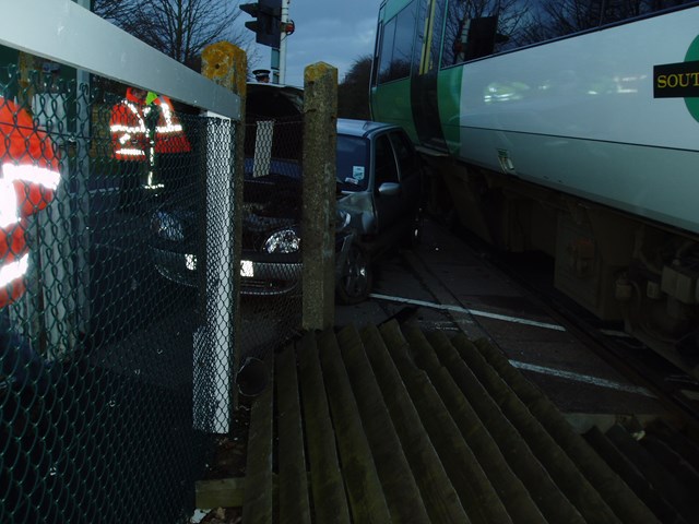 Motorist collides with train after running red lights at Winchelsea level crossing, Sussex