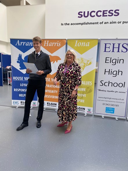 Moray Council's Head of Education, Vivienne Cross, and S6 pupil at Elgin High School Alfie Harper receives his results of 5 Higher As. Alfie is the school Dux and School House Leader.
