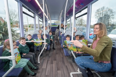 Cllr Ravilious reading on the bus