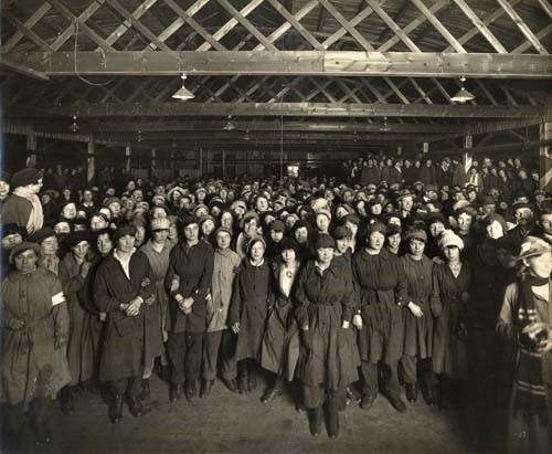 Inspirational Women: The Barnbow Lasses worked in the Barnbow Munitions Factory, where 35 women and girls were tragically killed in an explosion during the First World War. It remains the single biggest loss of life in the city’s history. Taken in 1918, this image shows the Armistice celebrations at the Barnbow National Filling Factory at the end of World War One. Credit Leodis.`