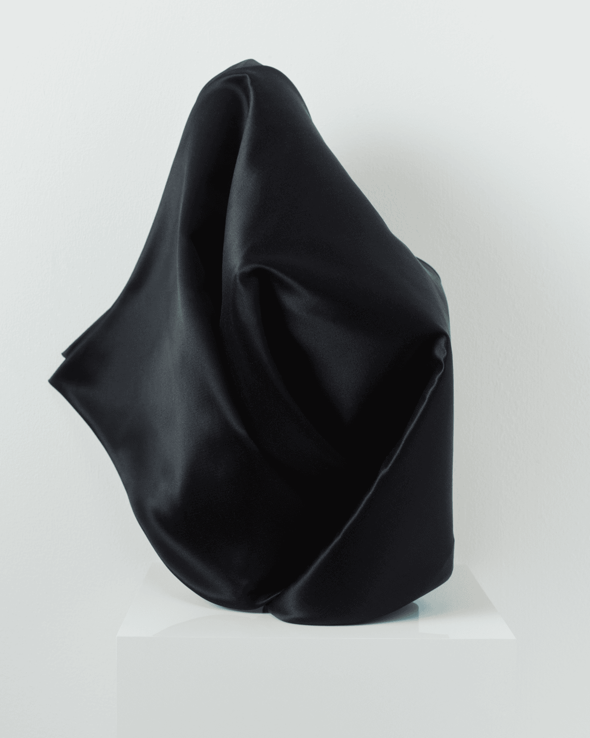 Image of a striking black cornette on a mannequin. 

Image Courtesy of JW Anderson.