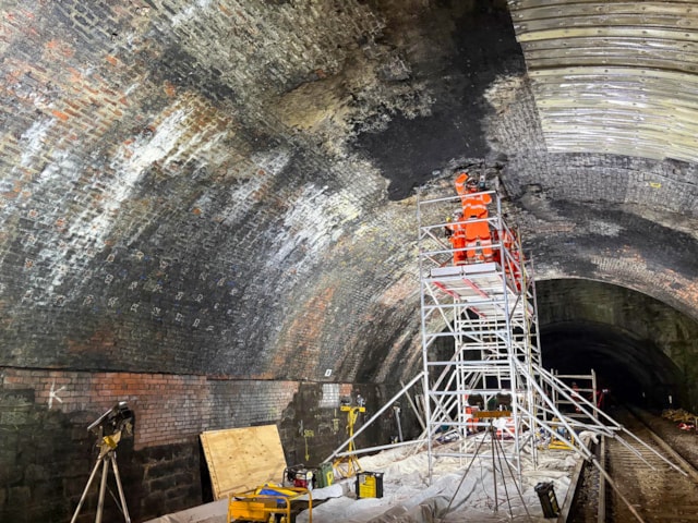 Wide shot of colleagues working inside St James Tunnel: Wide shot of colleagues working inside St James Tunnel