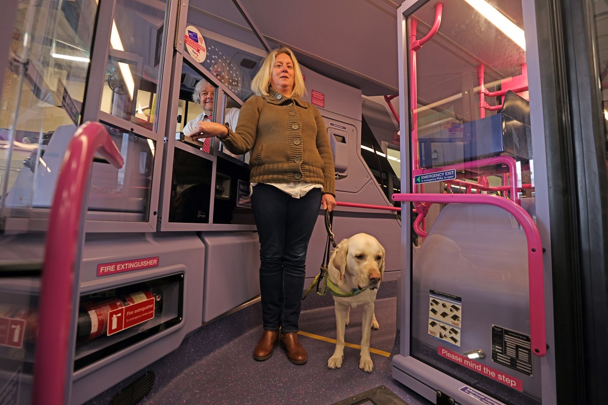 Verity with guide dog Ted and Keith Sheard of First York