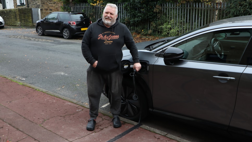 Mike Pickering with his new electric vehicle cross-pavement channel