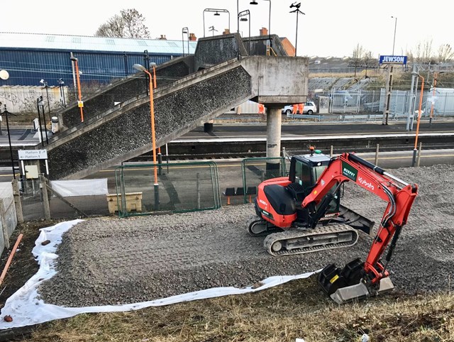 The current footbridge crossing at Stechford station beside a digger