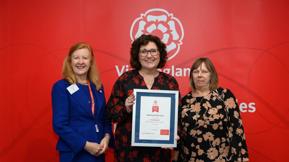 Adele Lavender and Julie Cartwright collecting the award on behalf of Red House Team