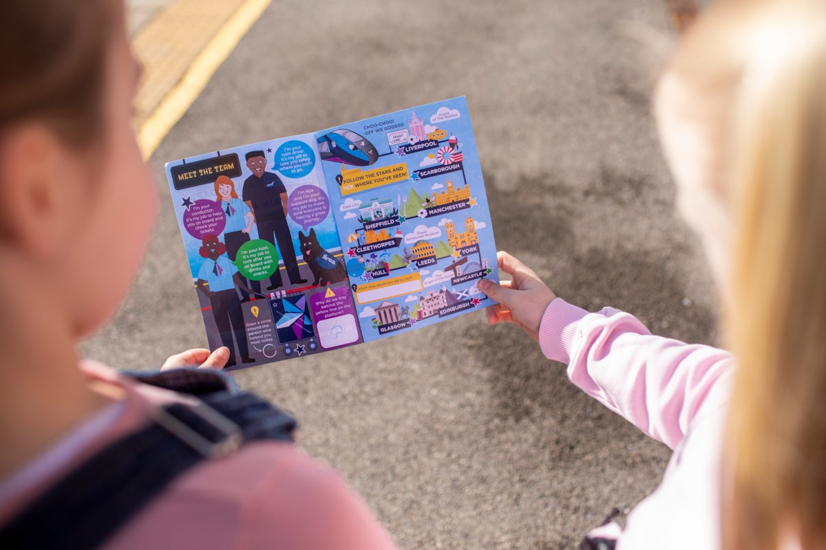 Lucy and Ivy, 7, check out the new TPE activity book