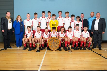 Provost Todd, Cllr Cown and Cllr Reid congratulate the S2 football team with HT Scott Robertson and teacher Charlie Adams