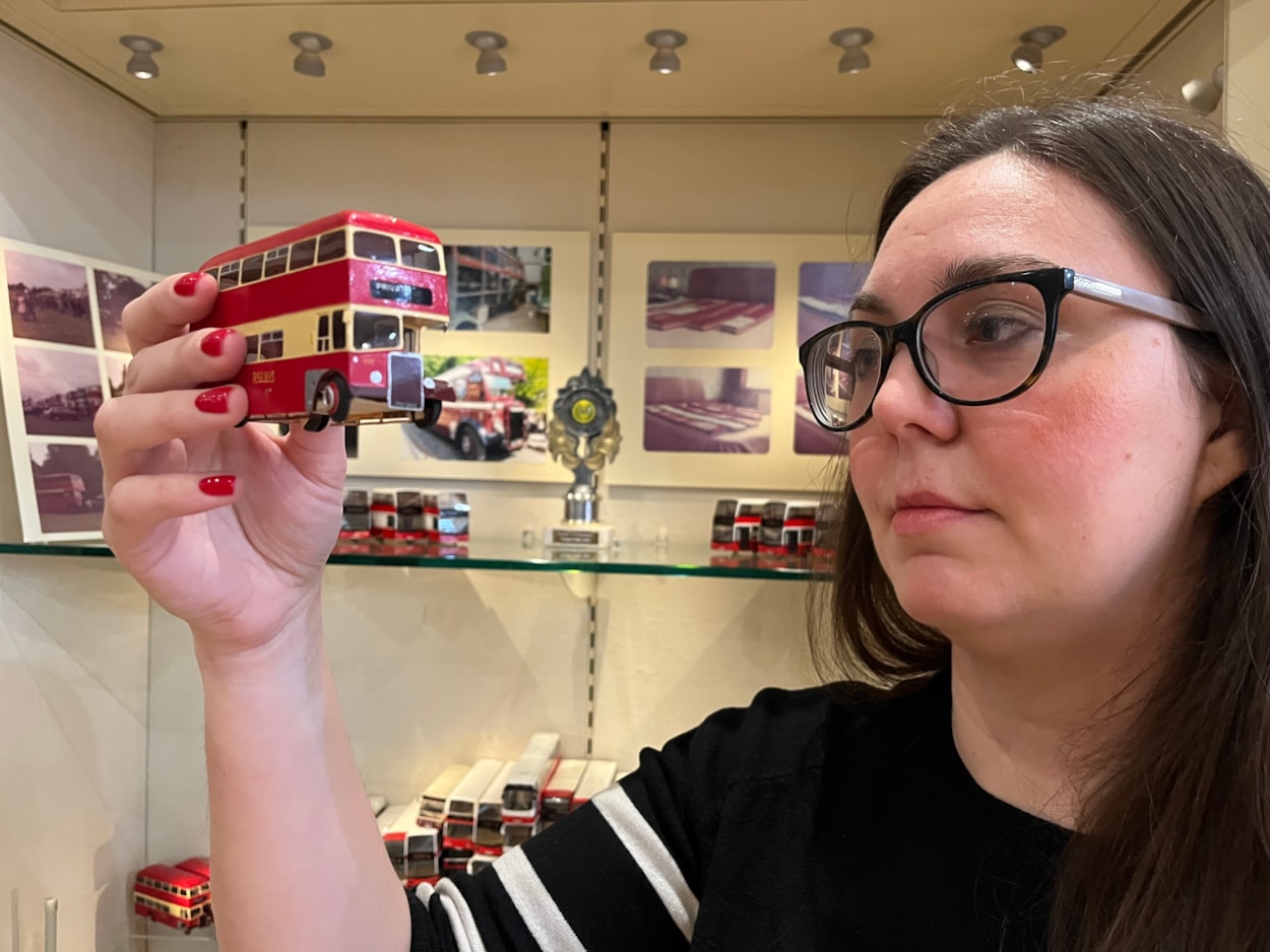 Bus collection: Assistant community curator Sapphia Cunningham-Tate alongside the new display at Leeds City Museum which gives visitors a chance to see a selection of the vast array of replicas created by physicist Dr Gordon Brooke.
The meticulously detailed models each relate to a specific real-life equivalent, complete with service number and with every painstaking detail reproduced using card, packaging and acetate for the windows.