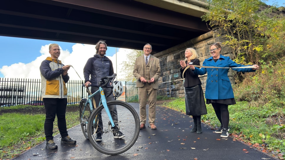 Cllr Warren Goldsworthy cuts the ribbon to officially open the new pathway with representatives from Preston City Council, Avanti, Network Rail and Community Rail Lancashire