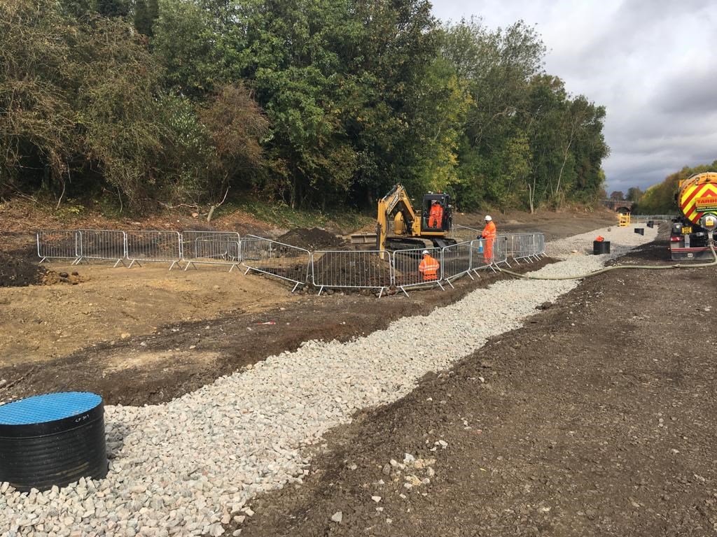 Network Rail workers begin to dig new track bed at Market Harborough railway station