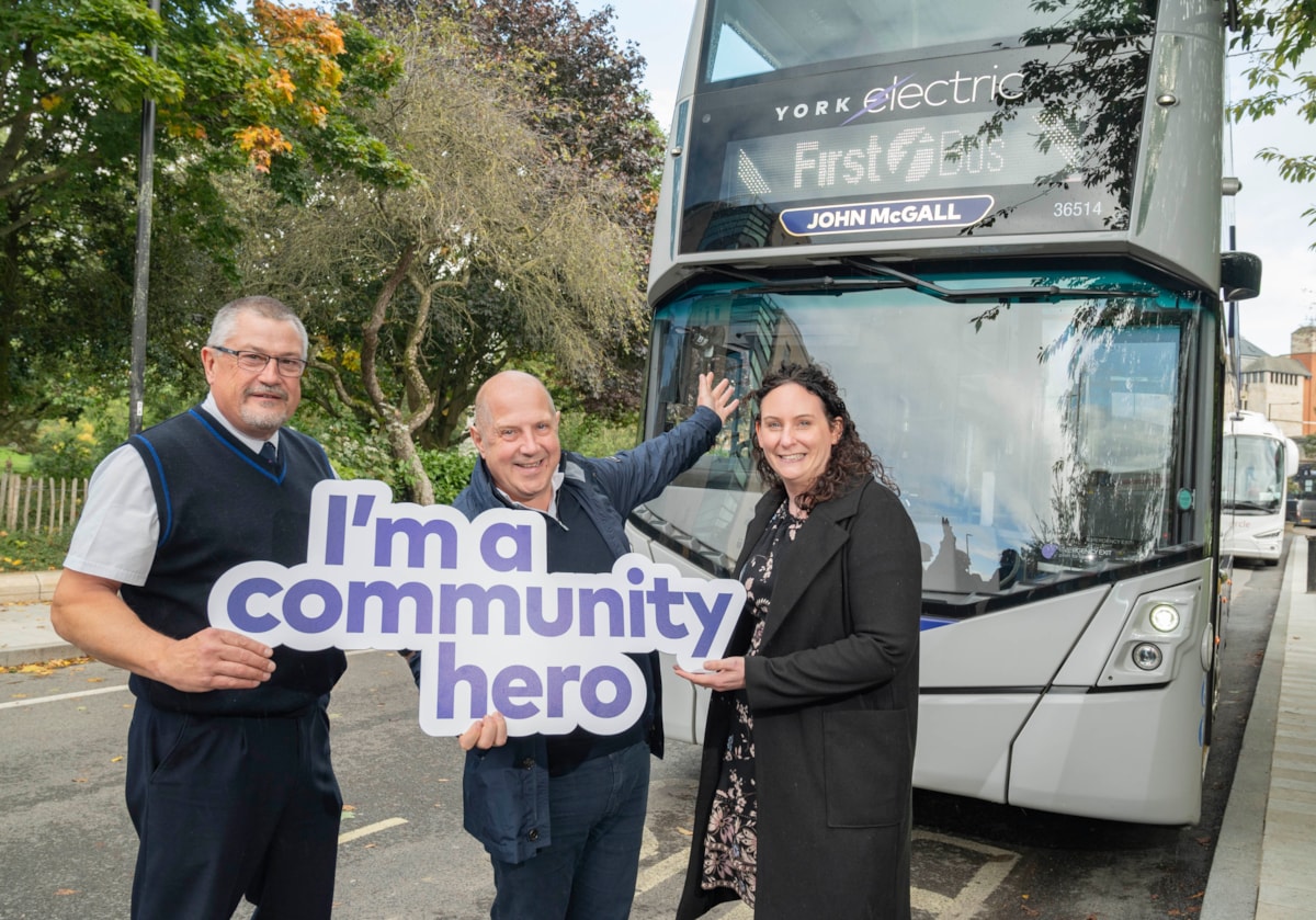 John McGall (centre) with driver Neil Allatt and Jenny Bartlett from First Bus