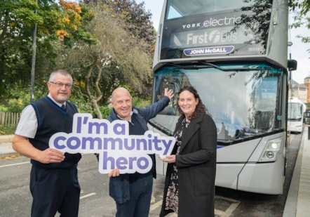 John McGall (centre) with driver Neil Allatt and Jenny Bartlett from First Bus