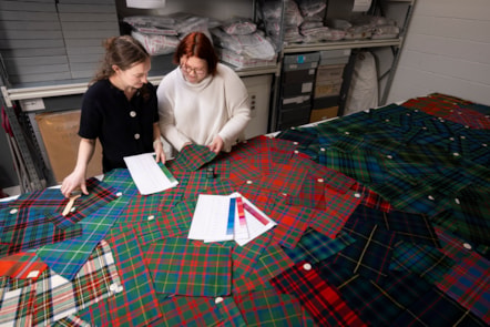 University of Glasgow students Lilly and Layla examine tartan samples. Photo © Duncan McGlynn (2)