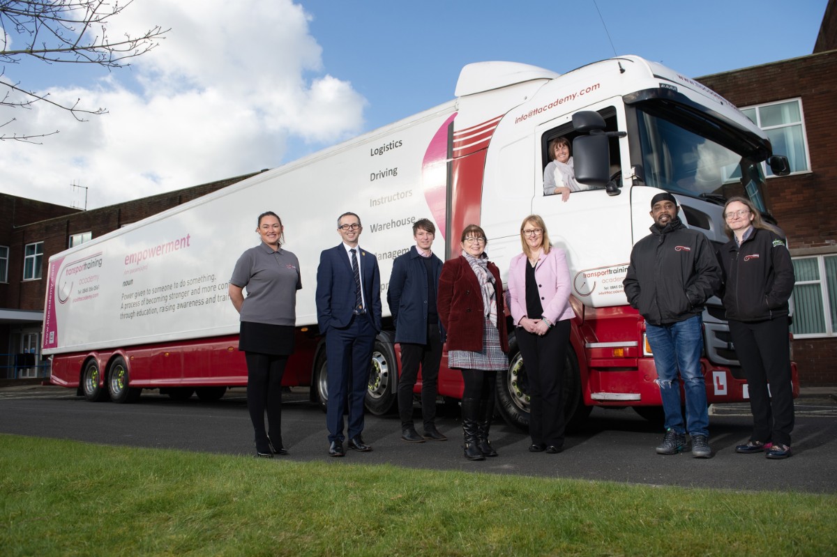 Leader of Lancashire County Council Phillippa Williamson sits in the Lancashire Skills Bootcamp truck at the Lancashire Business Park in Leyland. Pictured in front from left to right are Director of the Transport Training Academy Lauren Scanlin, County Councillor and Cabinet Member for Economic Development & Growth Aidy Riggott, Skills Bootcamp Officer Lancashire Skills and Employment Hub Stephen Norman, County Councillor and Cabinet Member for Education and Skills Jayne Rear, Director of the Lancashire Skills and Employment Hub Michele Lawty-Jones, Skills Bootcamp in HGV learner Glenroy Glabes and Head of Logistics Instruction and Driver Development at  the Transport Training Academy Julie Ann Kirkham.