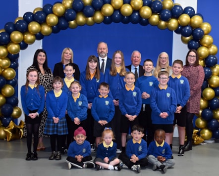 Dalmellington Primary School and ECC Headteacher Laura Clapperton (second left) leads the celebrations with Cllr Jim Kyle and Derek Forsyth