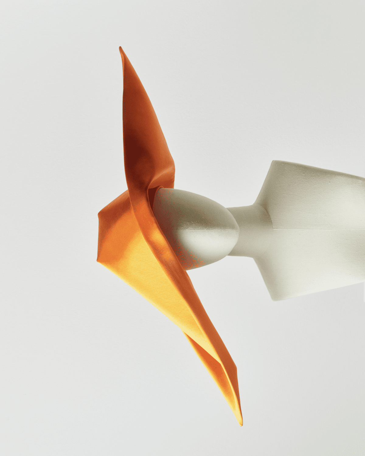 Image of a striking orange cornette on a mannequin. 

Image Courtesy of JW Anderson.